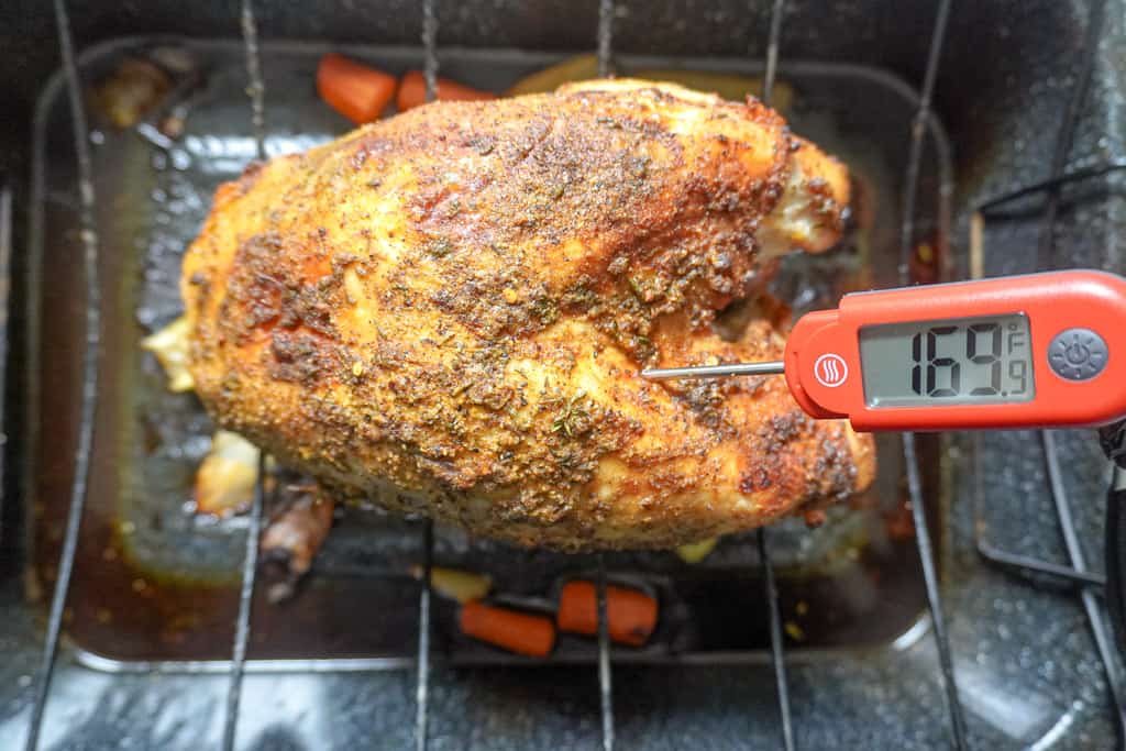 turkey breast with a meat thermometer inserted that reads 169