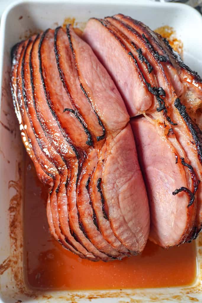 overhead view of browned spiral ham in baking dish