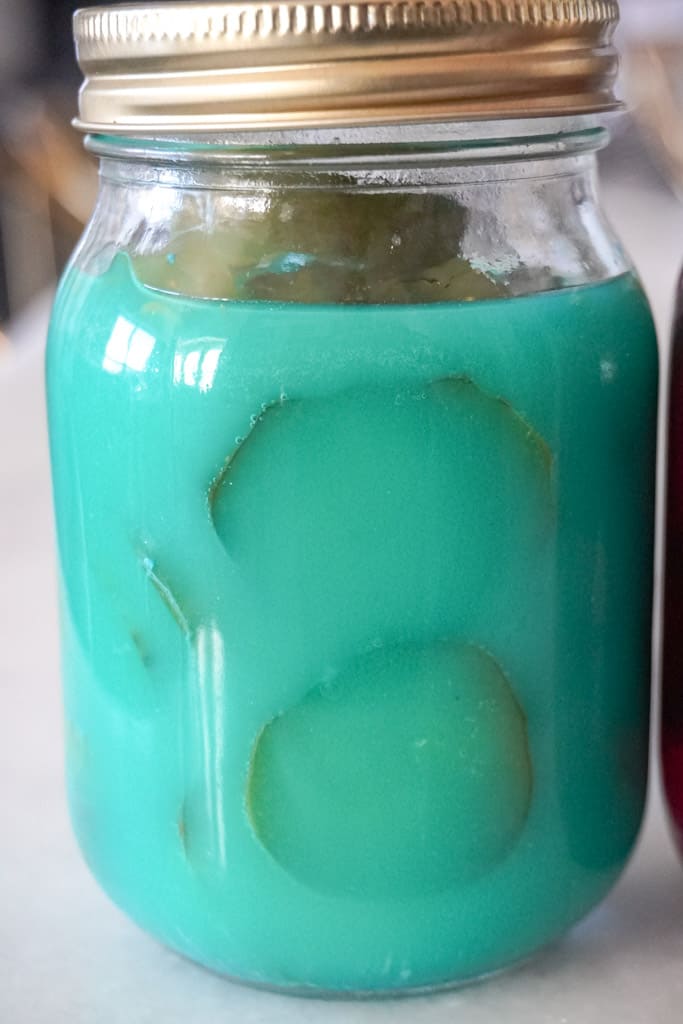 blue raspberry kool aid pickles in a jar