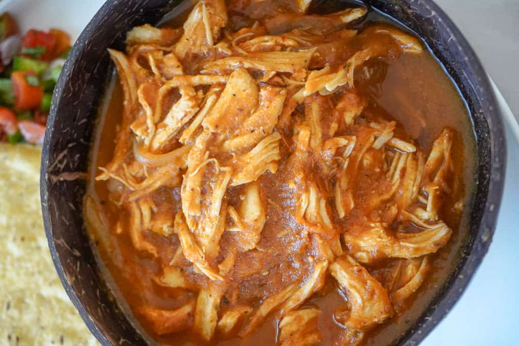close up view of chicken tinga in a bowl