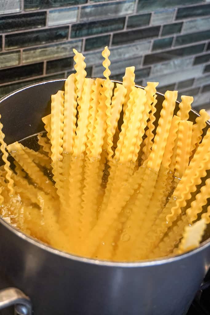 Mafaldine pasta added to a pot of water