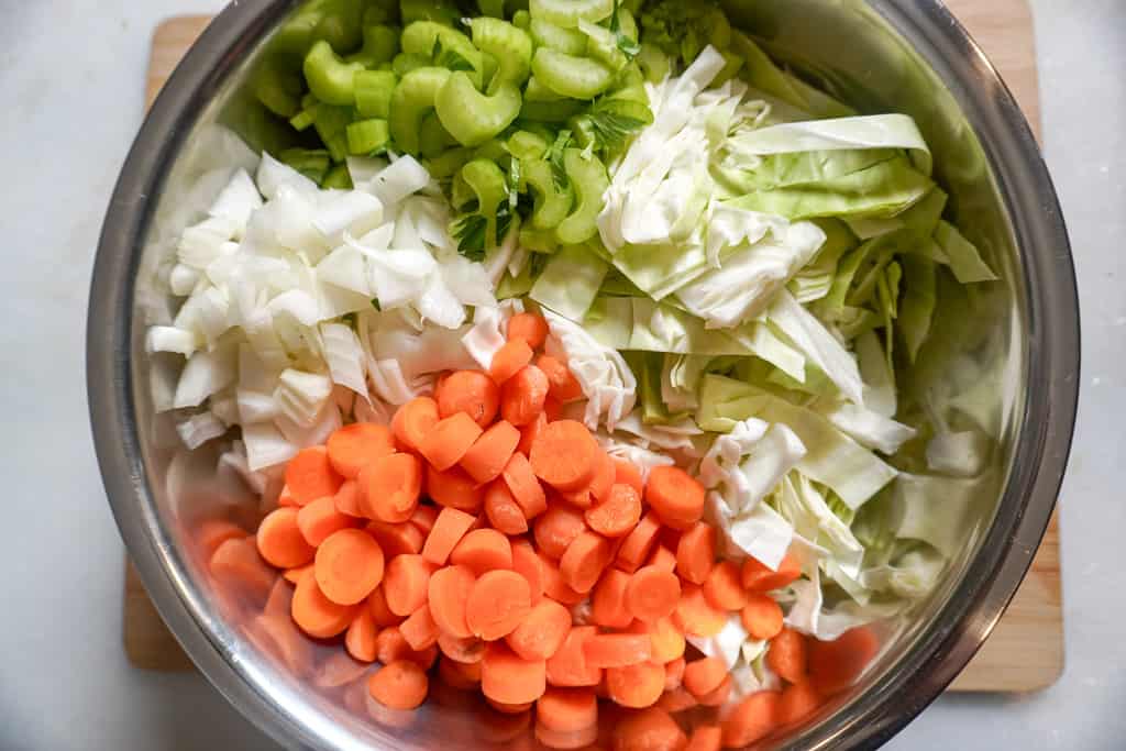 an assortment of chopped veggies in a bowl