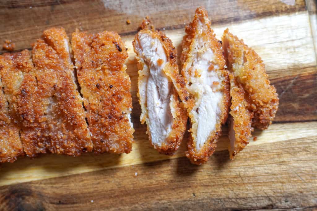 chopped chicken katsu on a cutting board