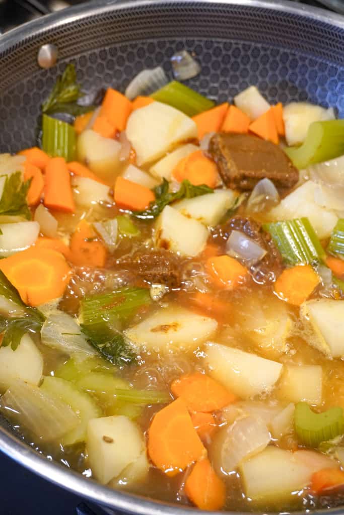 curried vegetables cooking in skillet