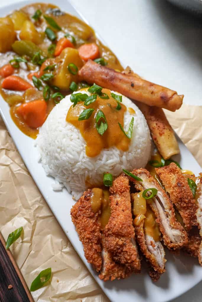 plated chicken katsu with white rice and curried vegetables
