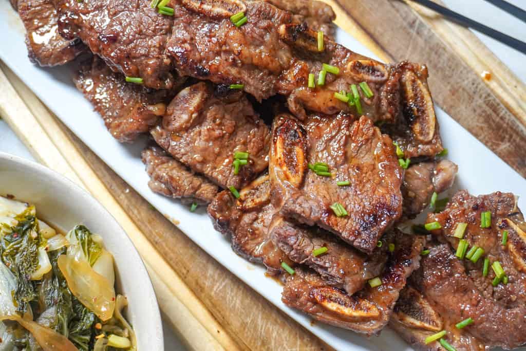 plated short ribs garnished with scallions