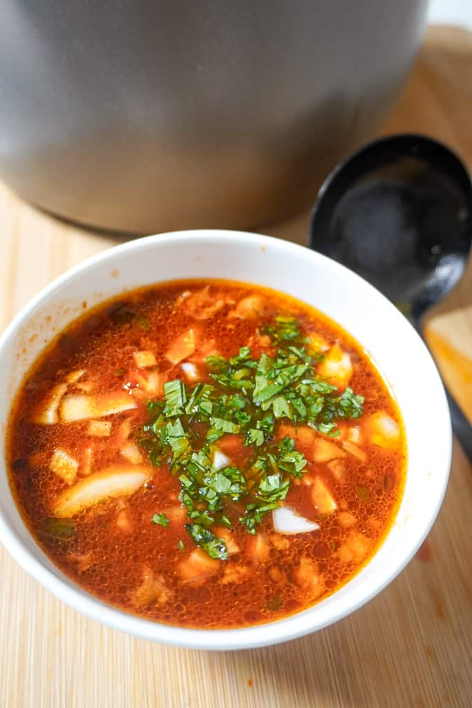 a bowl of consome for tacos