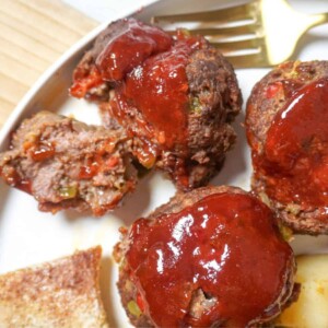 mini meatloaf on a plate cut open with a fork