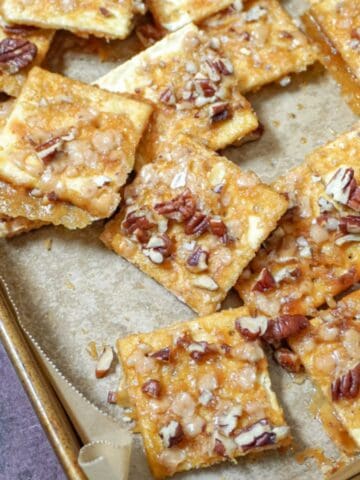 close up view of toffee cookies on a baking sheet