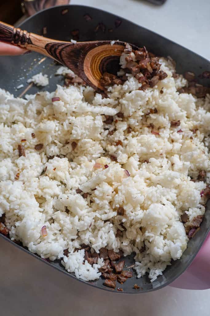 white rice frying in a pan