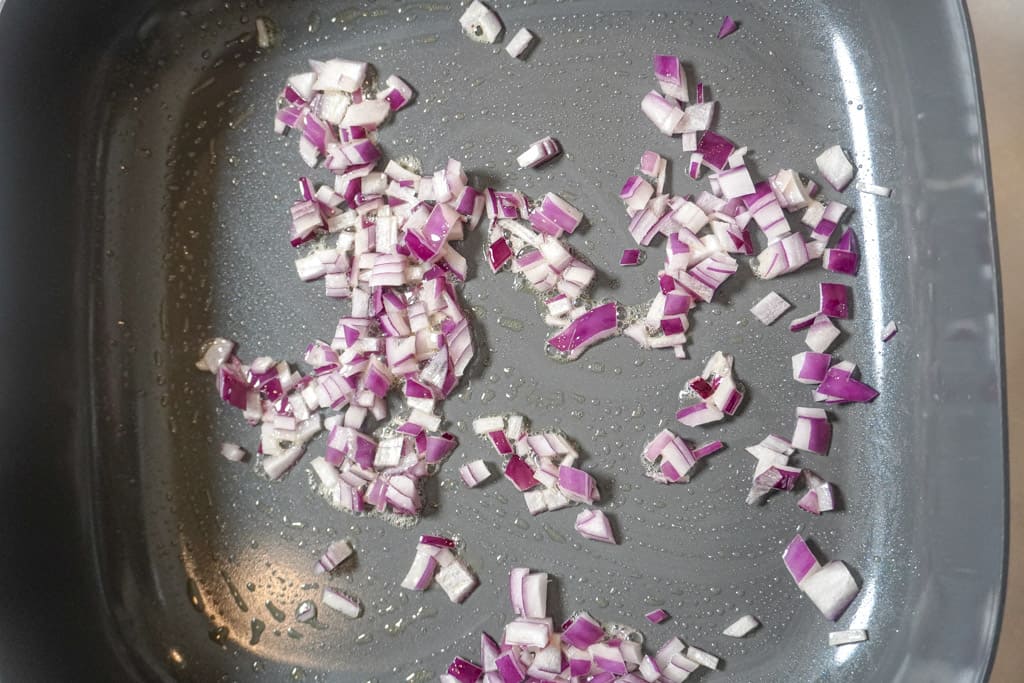 diced onions in a pan