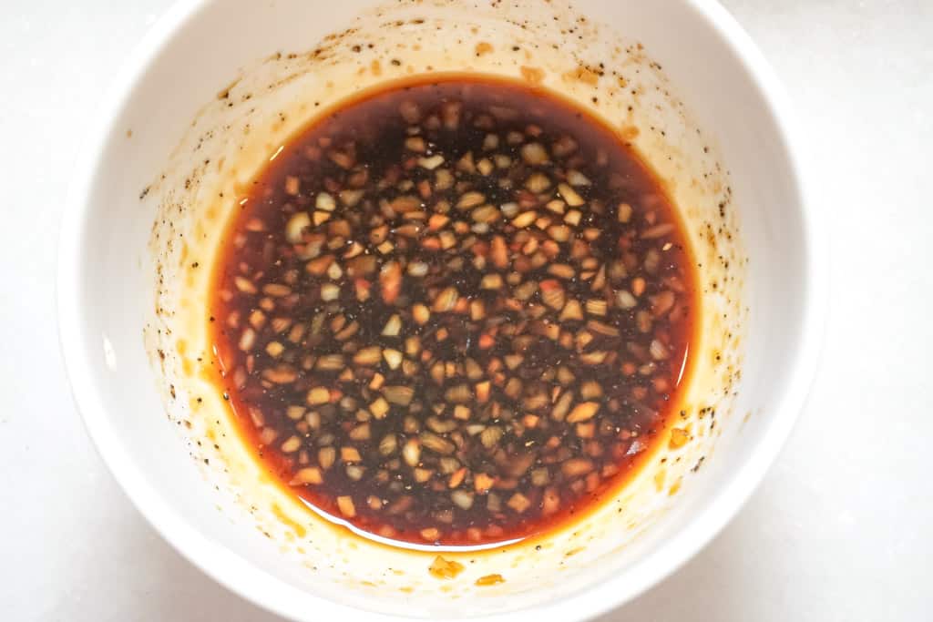 a small bowl of sauce made with soy sauce, oyster sauce, and sesame oil