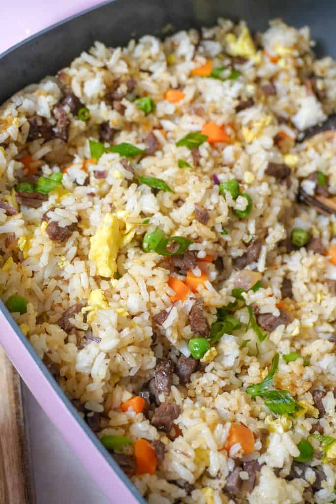 close up view of a skillet filled with steak fried rice made with leftover steak