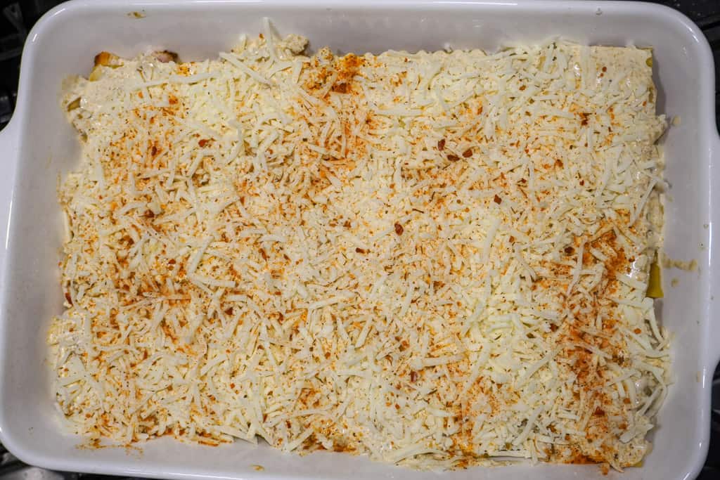 assembled lasagna in a casserole dish prior to baking