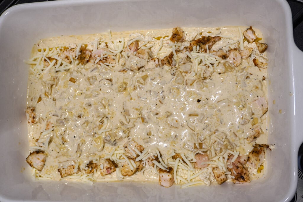 chicken layer of lasagna topped with cheese