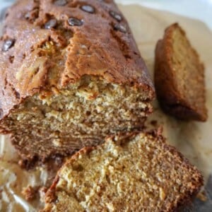 close up view of a banana bread loaf with two slices removed