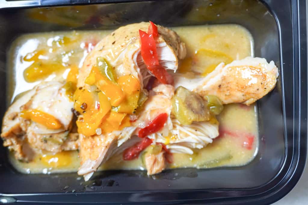cooked smothered chicken breast in baking dish