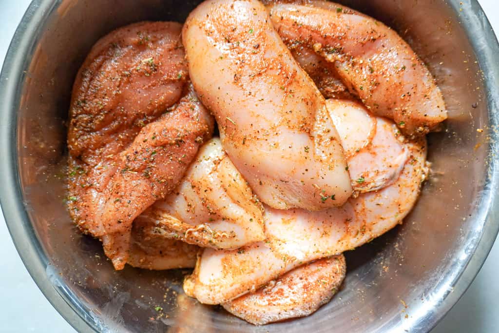 seasoned chicken breasts in a bowl