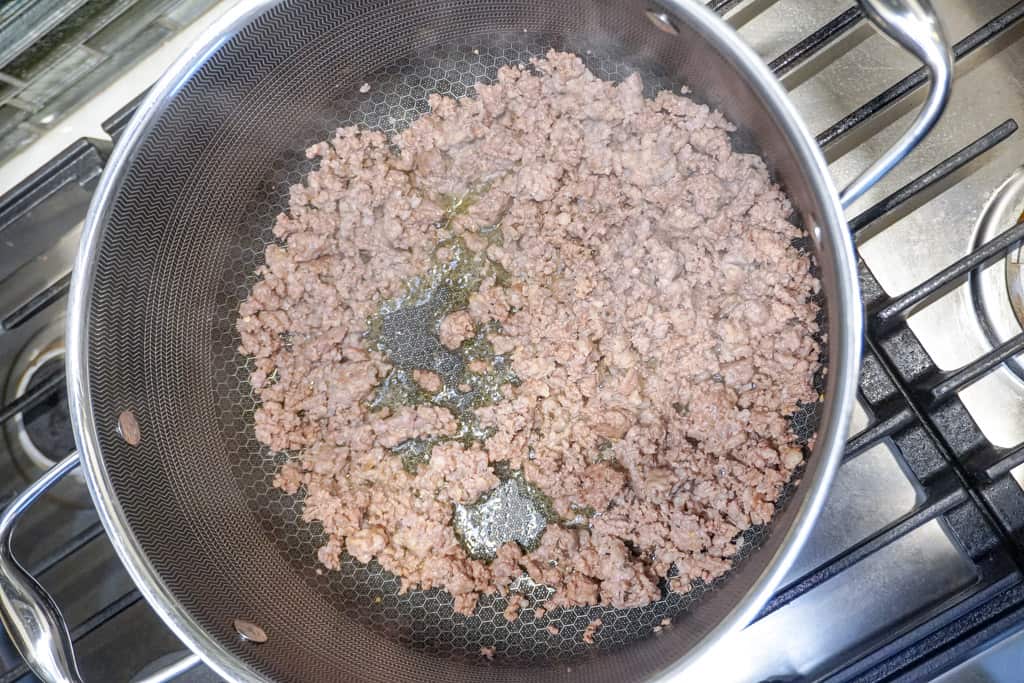 ground sausage cooking in a large pot