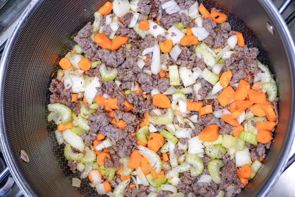 ground sausage and diced veggies in a large pot