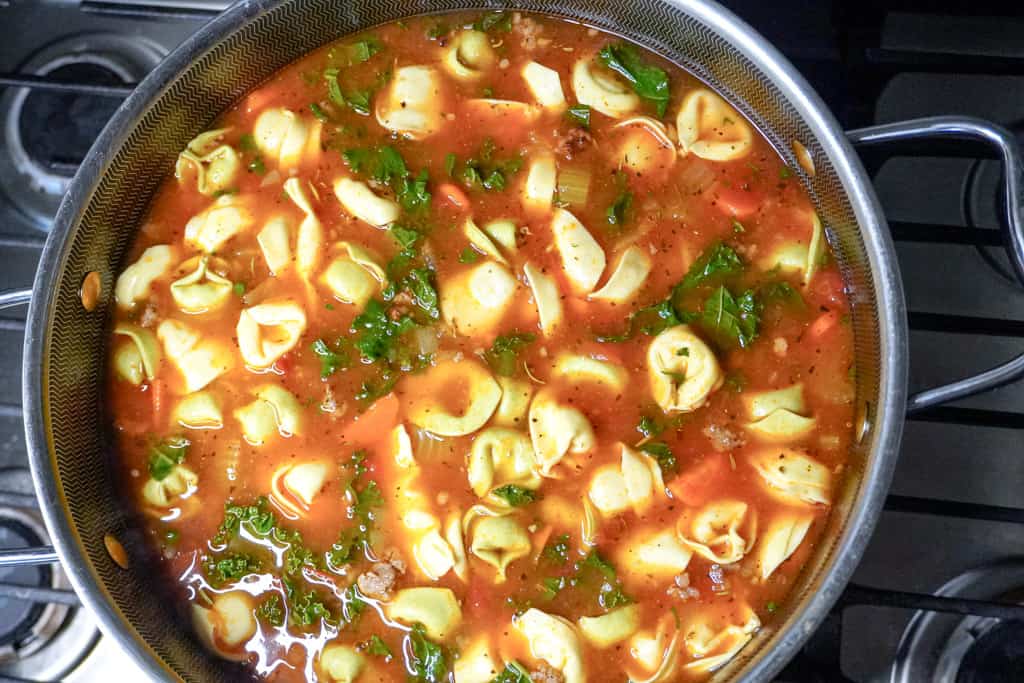 overhead view of a pot of sausage tortellini soup