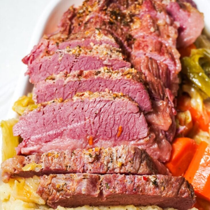 close up view of sliced instant pot corned beef and cabbage