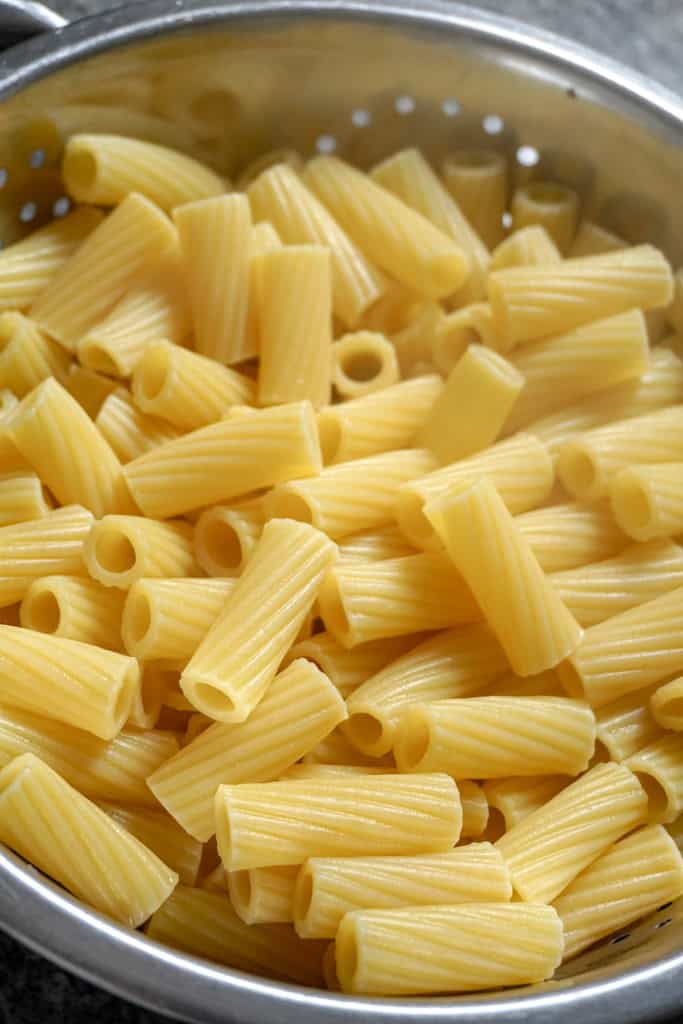 cooked rigatoni in a strainer