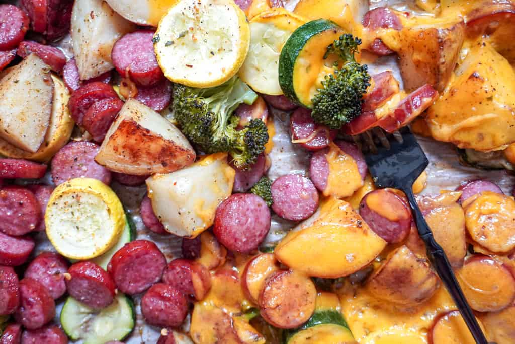 close up view of Sheet Pan Sausage and Veggies with cheese