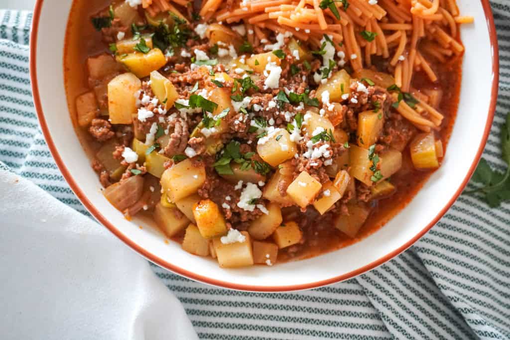 close up of picadillo or ground beef with potatoes in a bowl