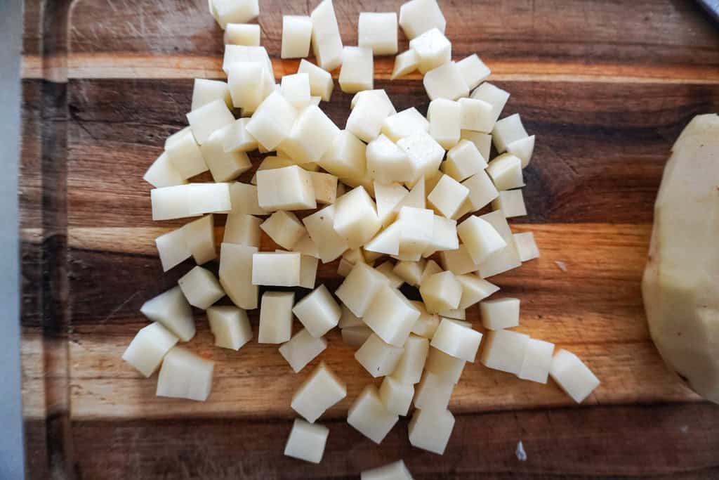 diced russet potatoes on a cutting board for ground beef and potatoes