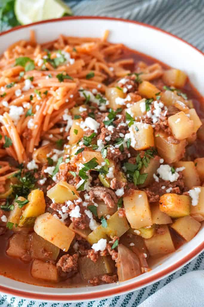 close up of picadillo in a bowl ground beef and potatoes