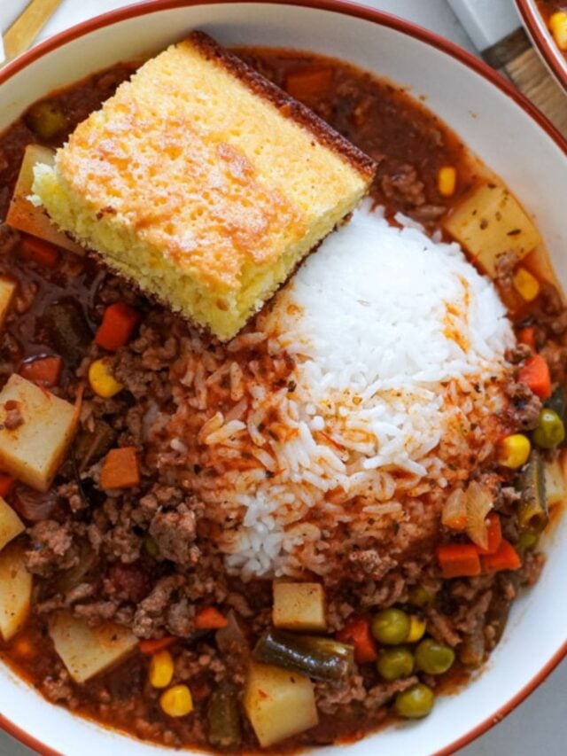 bowl of beef and veggie soup with a scoop of