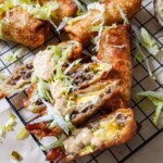 big mac egg rolls with big mac sauce drizzled on