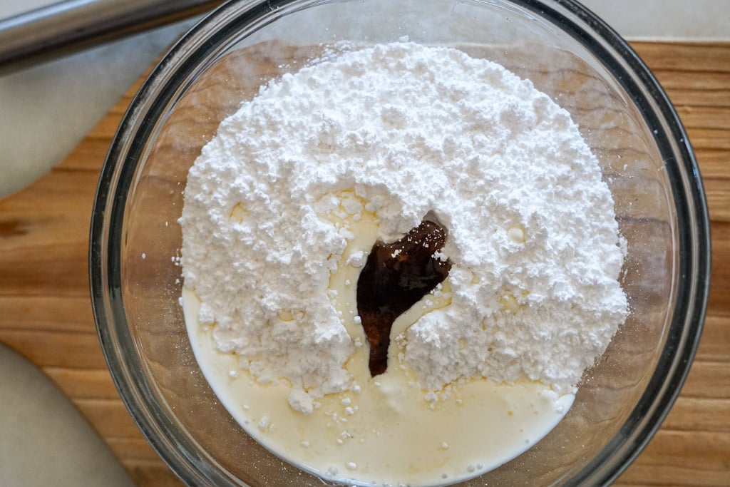 powdered sugar and vanilla extract in a bowl to make glaze