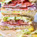 club sandwich cut in half stacked on top of each other