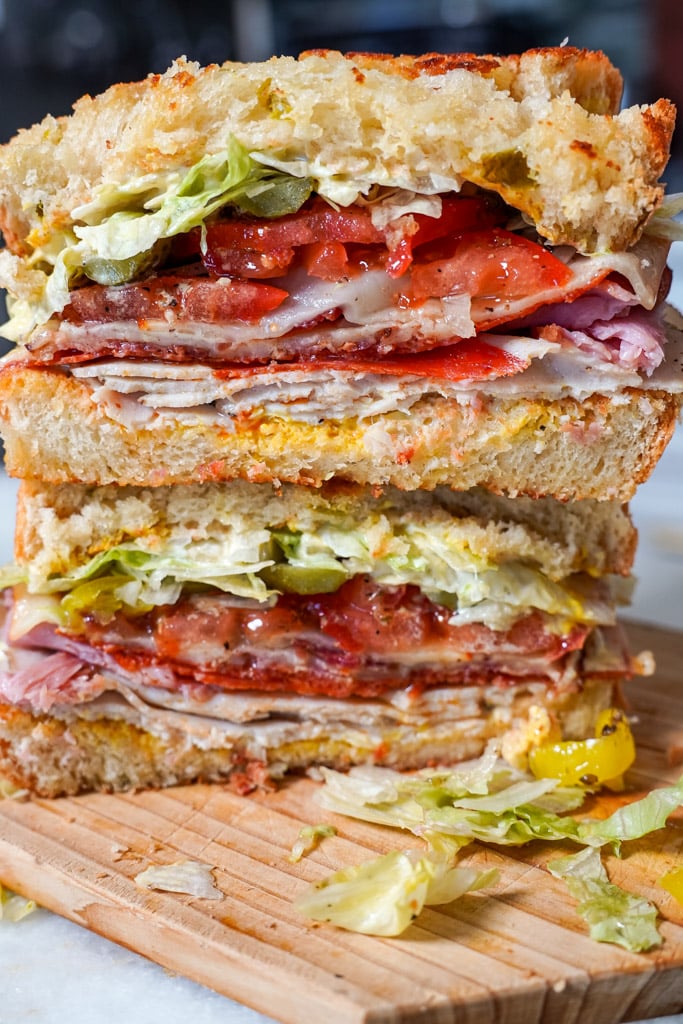 club sandwich cut in half stacked on top of each other