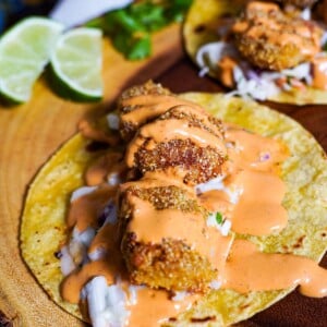 fried fish tacos on corn tortillas with coleslaw