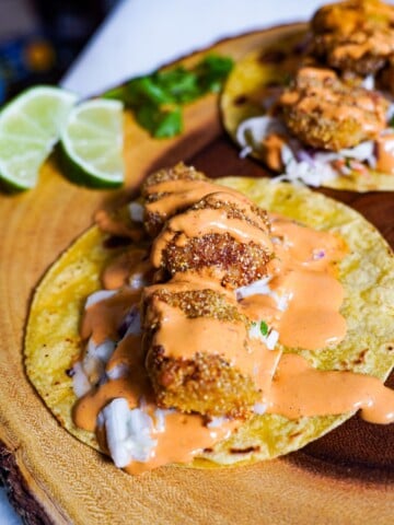 fried fish tacos on corn tortillas with coleslaw
