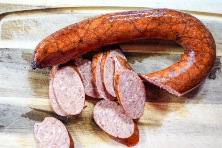 andouille sausage sliced up on a cutting board