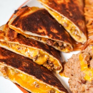 beef and cheese quesadillas on a white plate