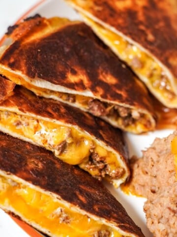 beef and cheese quesadillas on a white plate