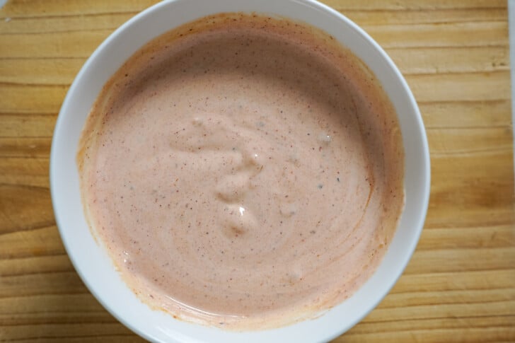 taco sauce and sour cream in a bowl for quesadillas