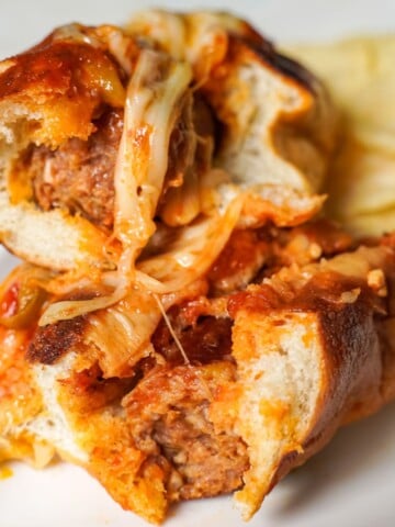 Italian sausage sandwich cut in half