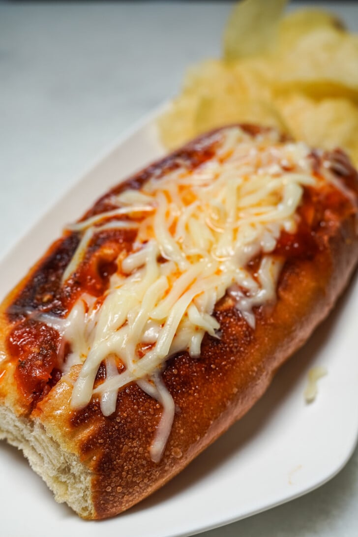 italian sausage sandwich on a white plate