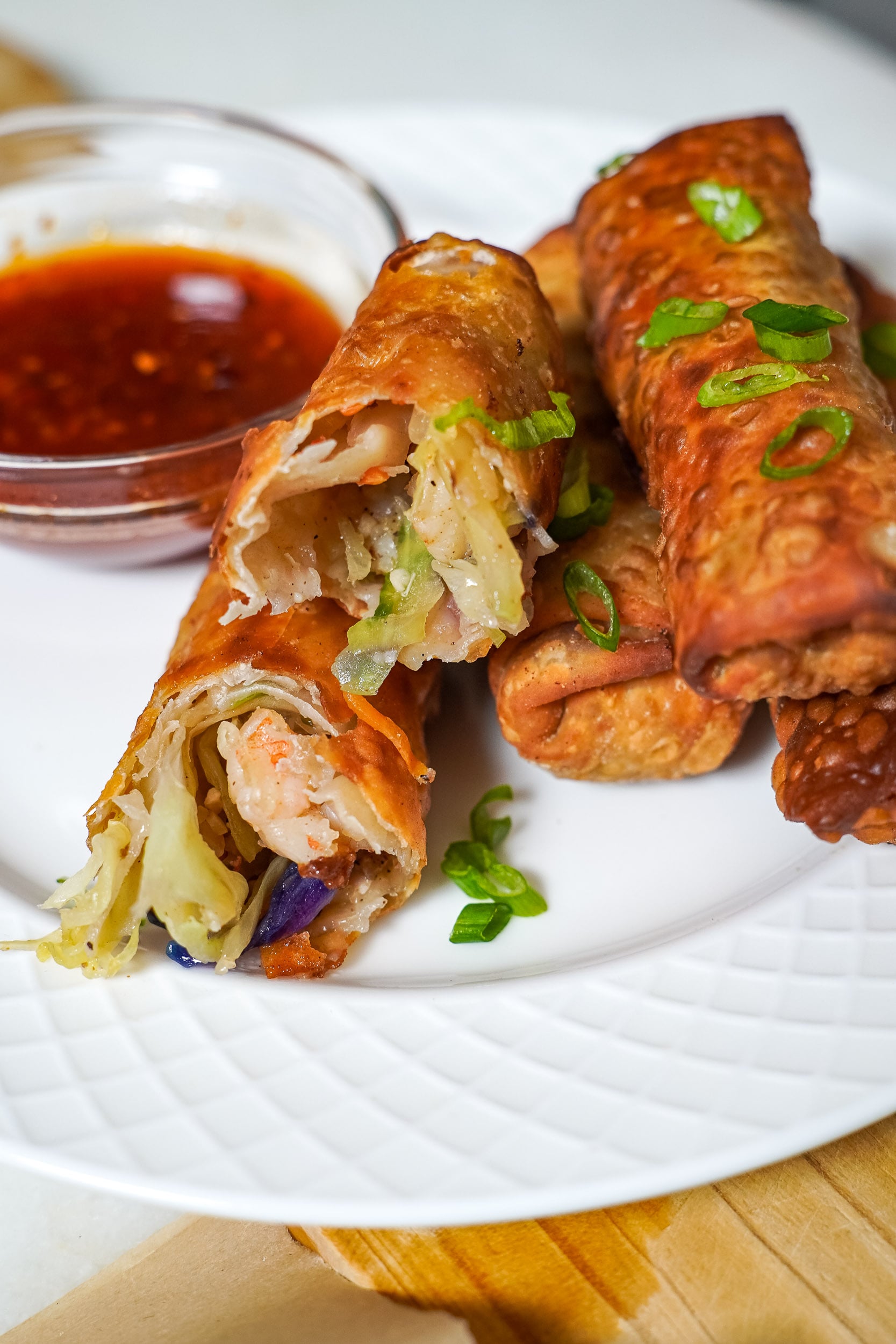 close up of shrimp egg rolls on a plate