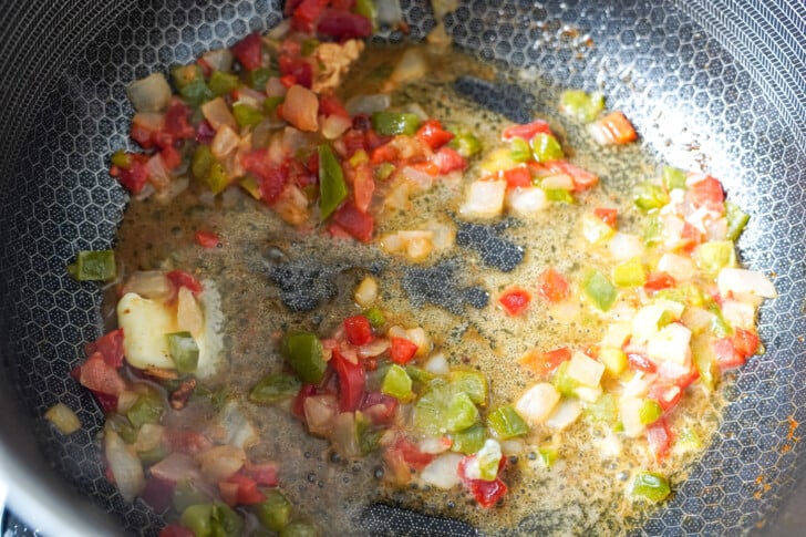 Peppers and onions sauteed in a pot