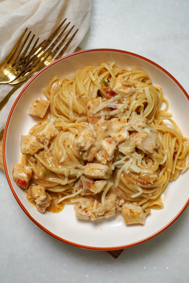 bowl of chicken tetrazzini with forks sitting next to it