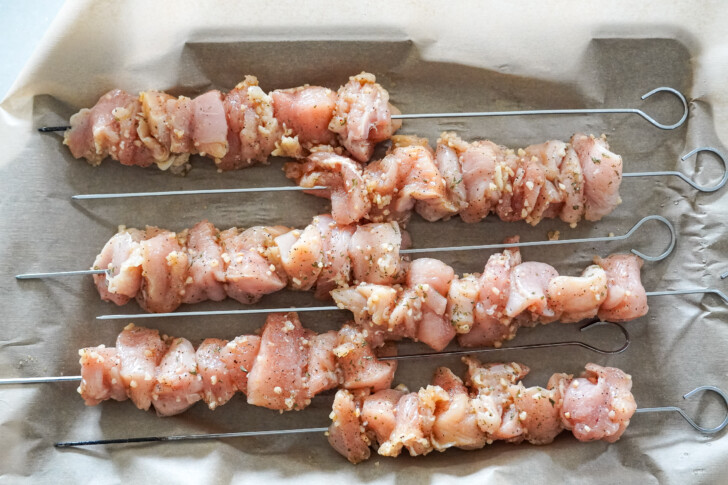 chicken skewers on a sheet pan