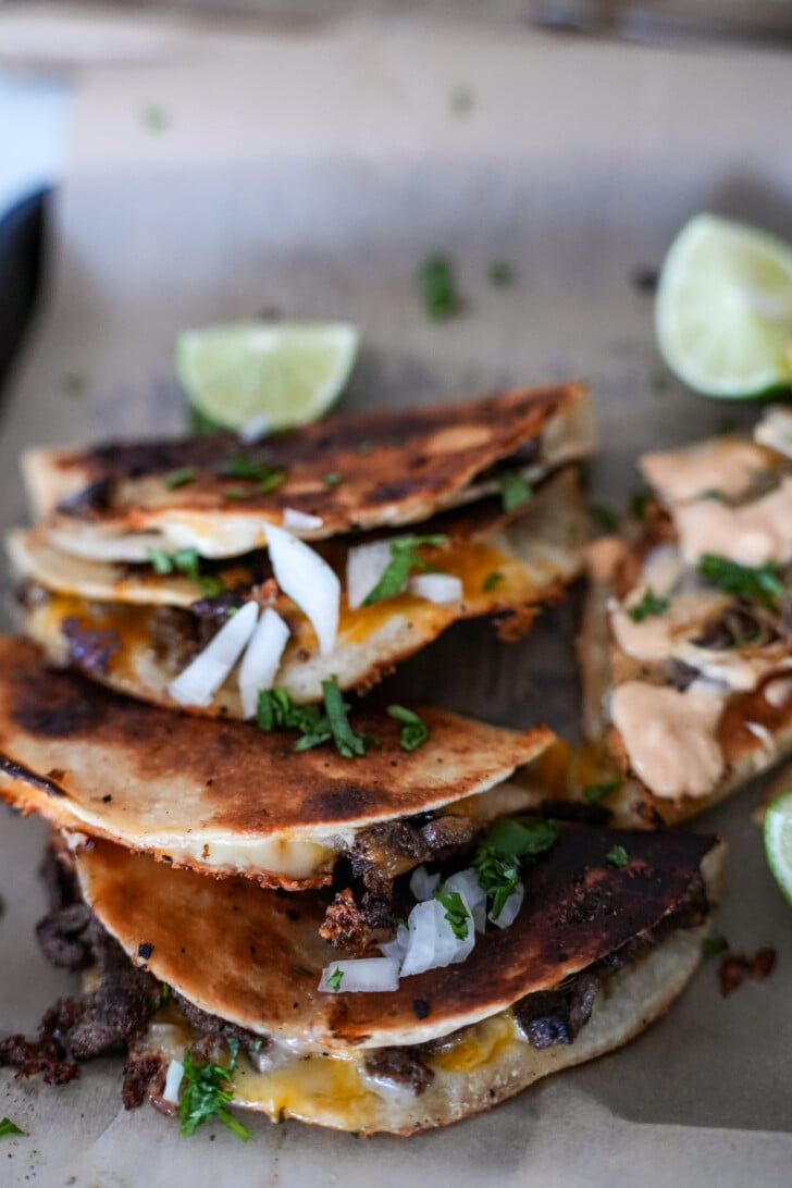 steak tacos on a tray with cilantro and onion