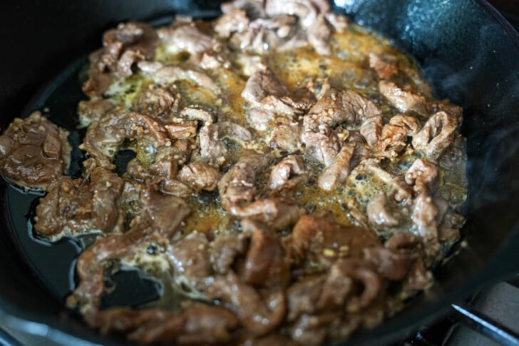 steak meat cooking in a skillet